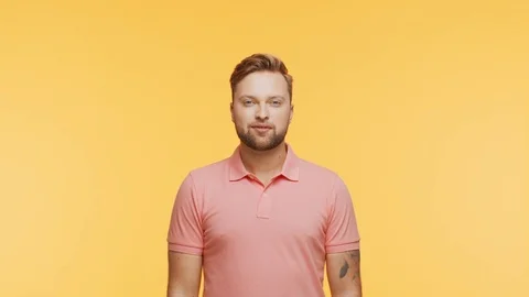 Expressive young man over vibrant background. Studio portrait of handsome person Stock Footage 126244338