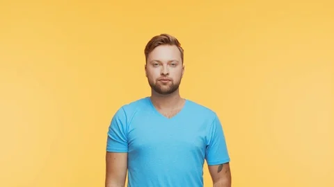 Expressive young man over vibrant background. Studio portrait of handsome person Stock Footage 126568145