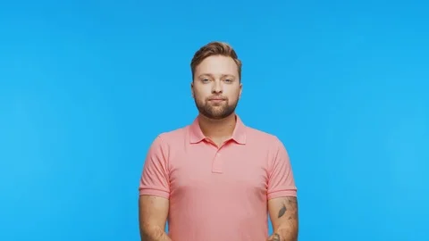 Expressive young man over vibrant background. Studio portrait of handsome person Stock Footage 126568166