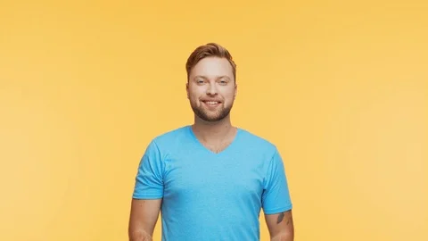 Expressive young man over vibrant background. Studio portrait of handsome person Stock Footage 126689660