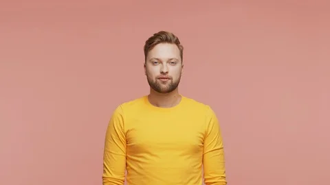 Expressive young man over vibrant background. Studio portrait of handsome person Video stock 126689701