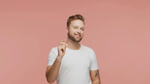 Expressive young man over vibrant background. Studio portrait of handsome person Stock Footage 126689990