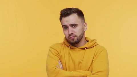 Expressive young man over vibrant background. Studio portrait of borred person. Stock Footage 137669200