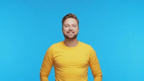 Expressive young man over vibrant background. Studio portrait of handsome person Stock Footage 264117334