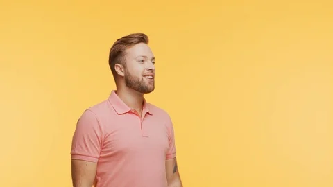 Expressive young man screaming and shouting over vibrant background. Portrait of Stock Footage 125066340