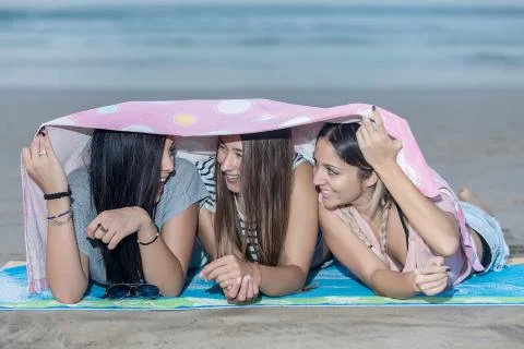 Expressive young model posing playfully on shore Stock Photos
