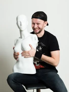 Expressive young rocker man posing with dummy Stock Photos
