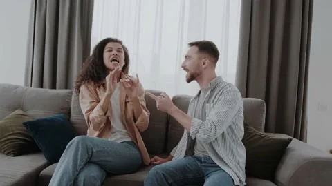 Expressively gesturing. Swearing couple having quarrel about their life together Stock Footage 163913791