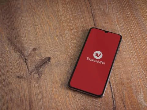 ExpressVPN app launch screen with logo on the display of a black mobile smart Stock Photos