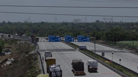 Expressway Traffic Passes Industrial Building, Aerial Drone Shot Vídeo Stock 345545686