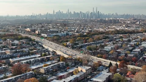 Expressway trench pointing at the Manhattan skyline from Queens Stock-Footage 167440503