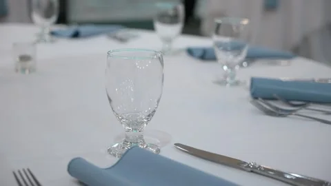 An Exquisite and Elegant Dining Setup Featuring Beautiful Blue Accents and Video stock 295008283
