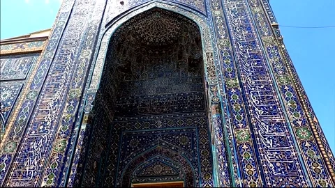 Exquisite blue tile facade and muqarnas arch at Shadi Mulk Aka mausoleum Stock Footage 336739519