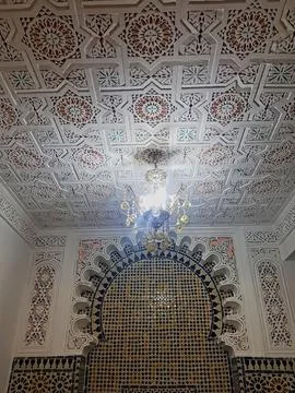 An exquisite chandelier features intricate patterns and ornate design elements Stock Photos
