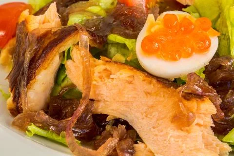 An exquisite close-up composition of a salad featuring tender flakes of salmo Stock Photos