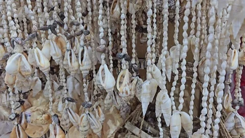 An exquisite close up of intricate shell and bead wind chimes Stock Footage 312003363