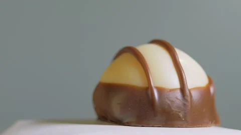 Exquisite delicious handmade chocolates isolated on white background, rotation Stock Footage 150364024
