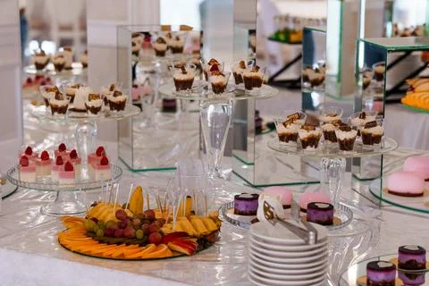 Exquisite Dessert Table Featuring an Array of Elegant Sweet Treats and Fres.. Stock Photos