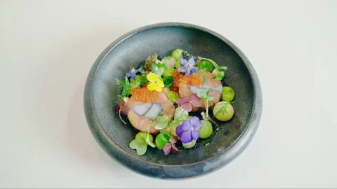 An exquisite fine dining gourmet dish featuring salmon fish, red caviar, Stock Footage 237612385