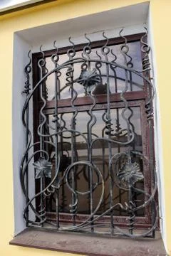 Exquisite forged grille on the window. Stockfoto's