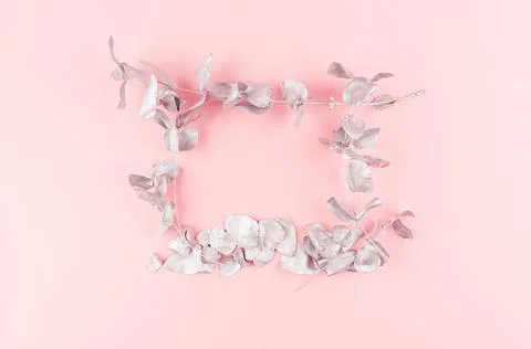 Exquisite gentle background - blank frame of silver twigs and leaves on paste Foto stock