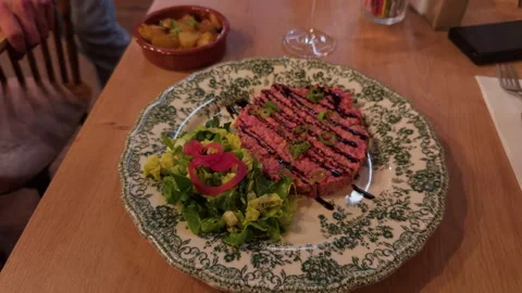 Exquisite Presentation of a Gourmet Dish using Fresh, HighQuality Ingredients on Stock Footage 318554981