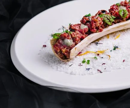 Exquisite serving beef tartare on plate Stock Photos