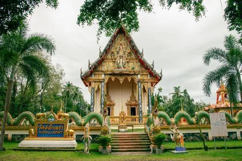 An Exquisite Temple Elegantly Surrounded by Vibrant Lush Greenery and Natures Stock Photos