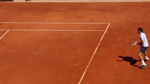 Ext Day - Roger Federer playing tennis on a clay surface - 01 Stock Footage 170558564