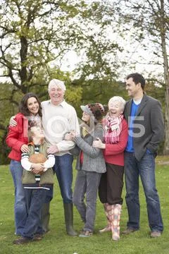 Extended family group on walk through countryside Stock Photos