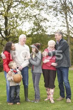Extended family group on walk through countryside Stock Photos