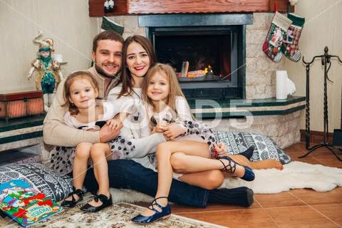 Extended Family Relaxing Together at the fireplace Stock Photos