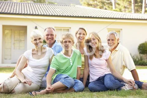 Extended Family Sitting Outside Dream Home Stock Photos