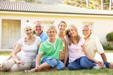 Extended Family Sitting Outside Dream Home Stock Photos