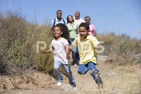 Extended Family walking in countryside Stock Photos