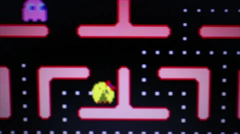 Extended Medium dolly shot follow Ms. Pac Man Game Play Stock Footage 66786261