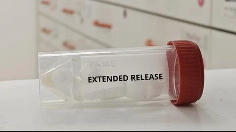 EXTENDED RELEASE tablets designed for prolonged drug release and effect Stock Photos