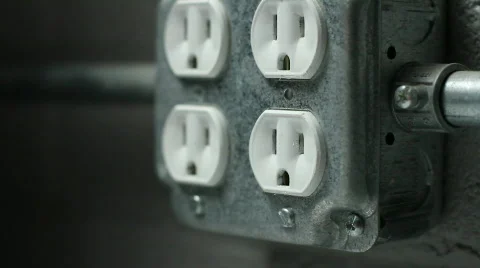 Extension cord getting plugged into power outlet Stock Footage 772683