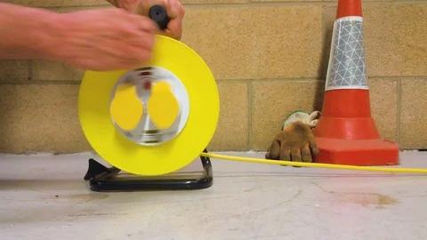 Extension lead drum being reeled in Stock Footage 96463388