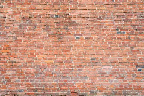Extensive brick wall background with many bricks uniform pattern wide surface 写真素材