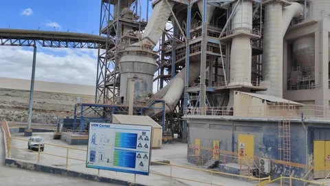 Extensive Conveyor Systems and Storage Silos at Cement Plant 4K Tracking Shot Stock Footage 331682968