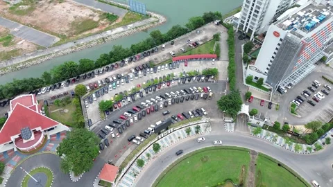 Extensive drone footage shows a complex cityscape with large parking lots. Stock Footage 319608529