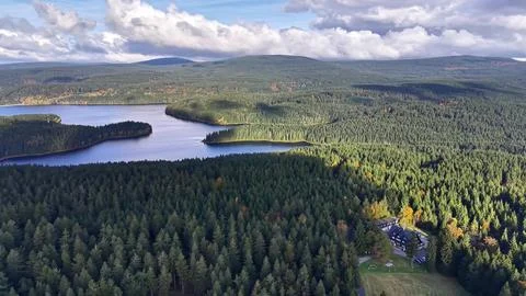 Extensive Drone Imagery Capturing Tranquil Lake Views Encircled By Dense Tr.. Photos