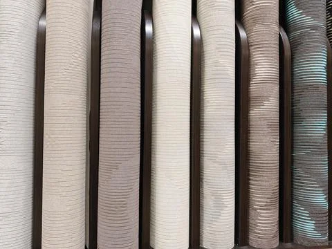 An extensive range of wallpaper rolls with diverse textures, colors, and pa.. 写真素材