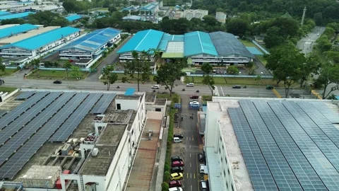 Extensive rooftop solar infrastructure transforms industrial buildings into.. Stock Footage 335126951