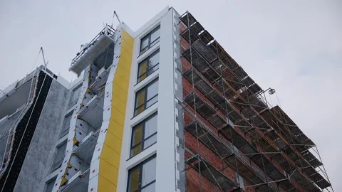 Extensive scaffolding providing platforms for work in progress on a new Stock Footage 259208476