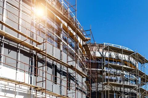 Extensive scaffolding providing platforms for work in progress on a new apart Stock Photos