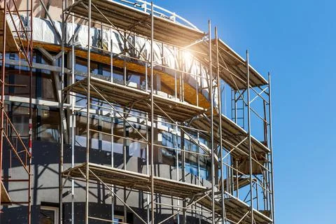Extensive scaffolding providing platforms for work in progress on a new apart Stock Photos