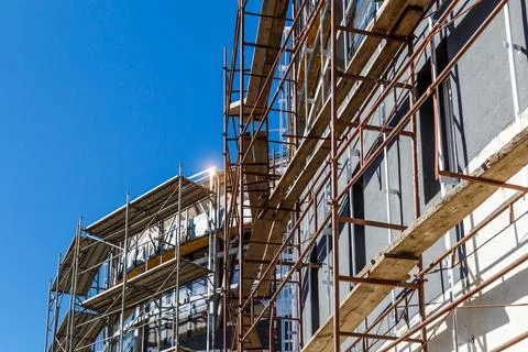 Extensive scaffolding providing platforms for work in progress on a new apart Stock Photos