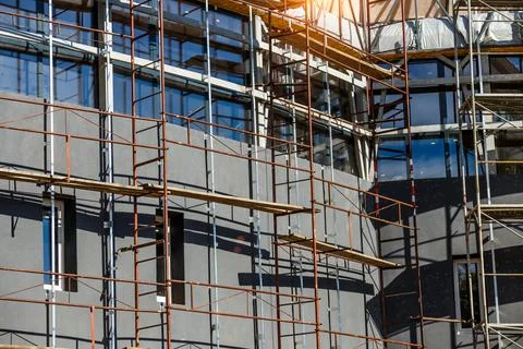 Extensive scaffolding providing platforms for work in progress on a new apart Stock Photos